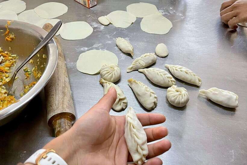 Kathmandu: Traditional Momo Making Class & Pickup - The market/shop tour: how you pick better fillings